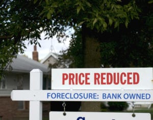 Foreclosed homes are owned by a delinquent taxpayer